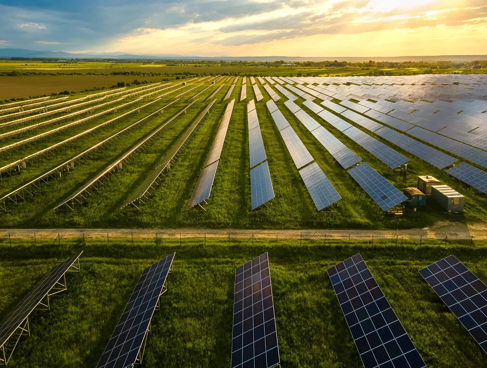 Utility-scale solar farm at sunset